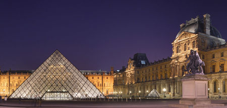 The Louvre Palace and the pyramid by night
